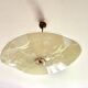 Pale yellow asymmetrical suspension cup 1960