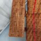 Sunbathing sunbathing in wicker rattan wood deckchair red lounger