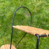 Wall shelf made of rattan and wrought iron