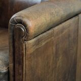 Beautiful vintage sheep leather armchair with a characterful appearance