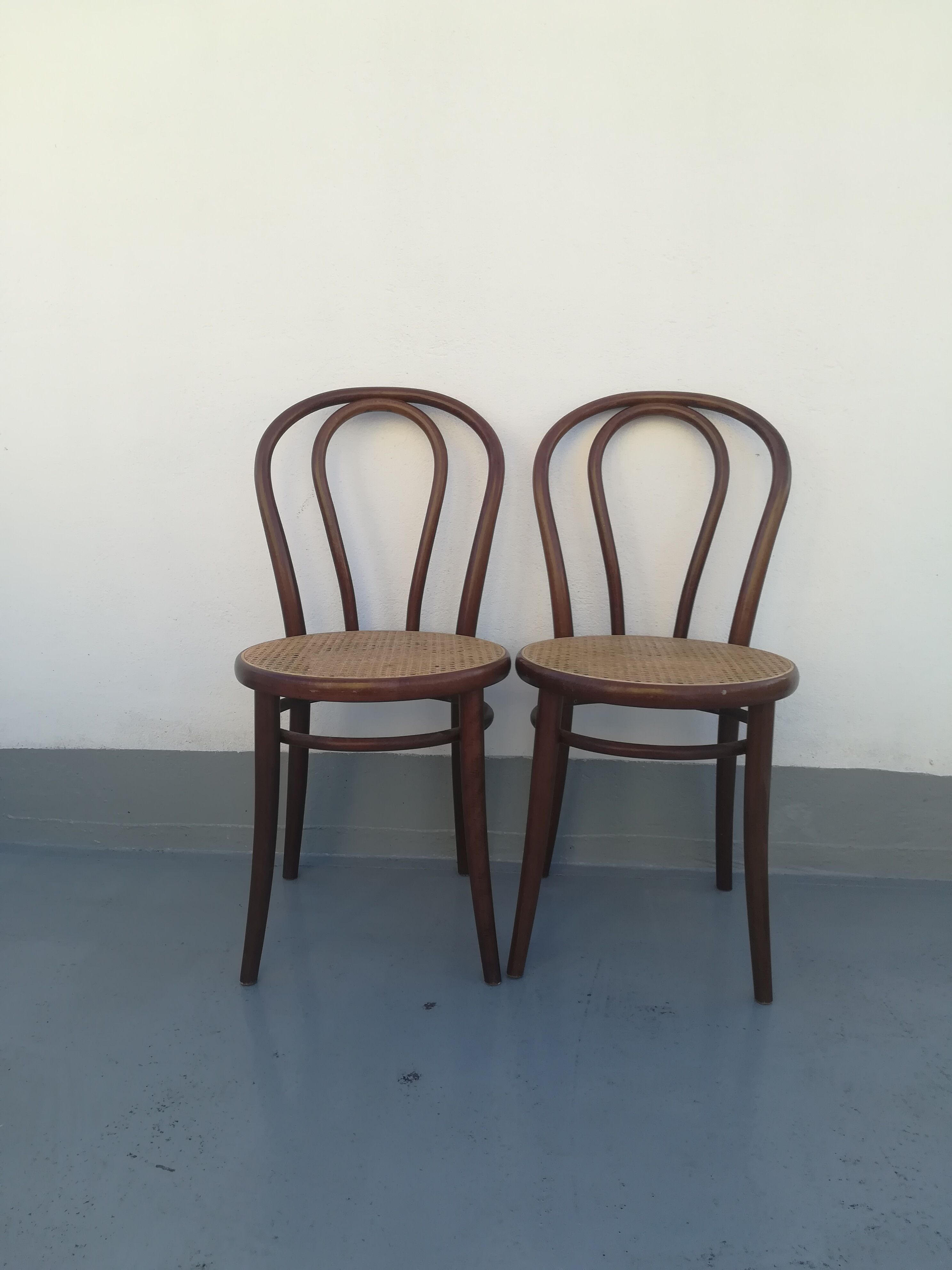 2 Curved wooden bistro chairs