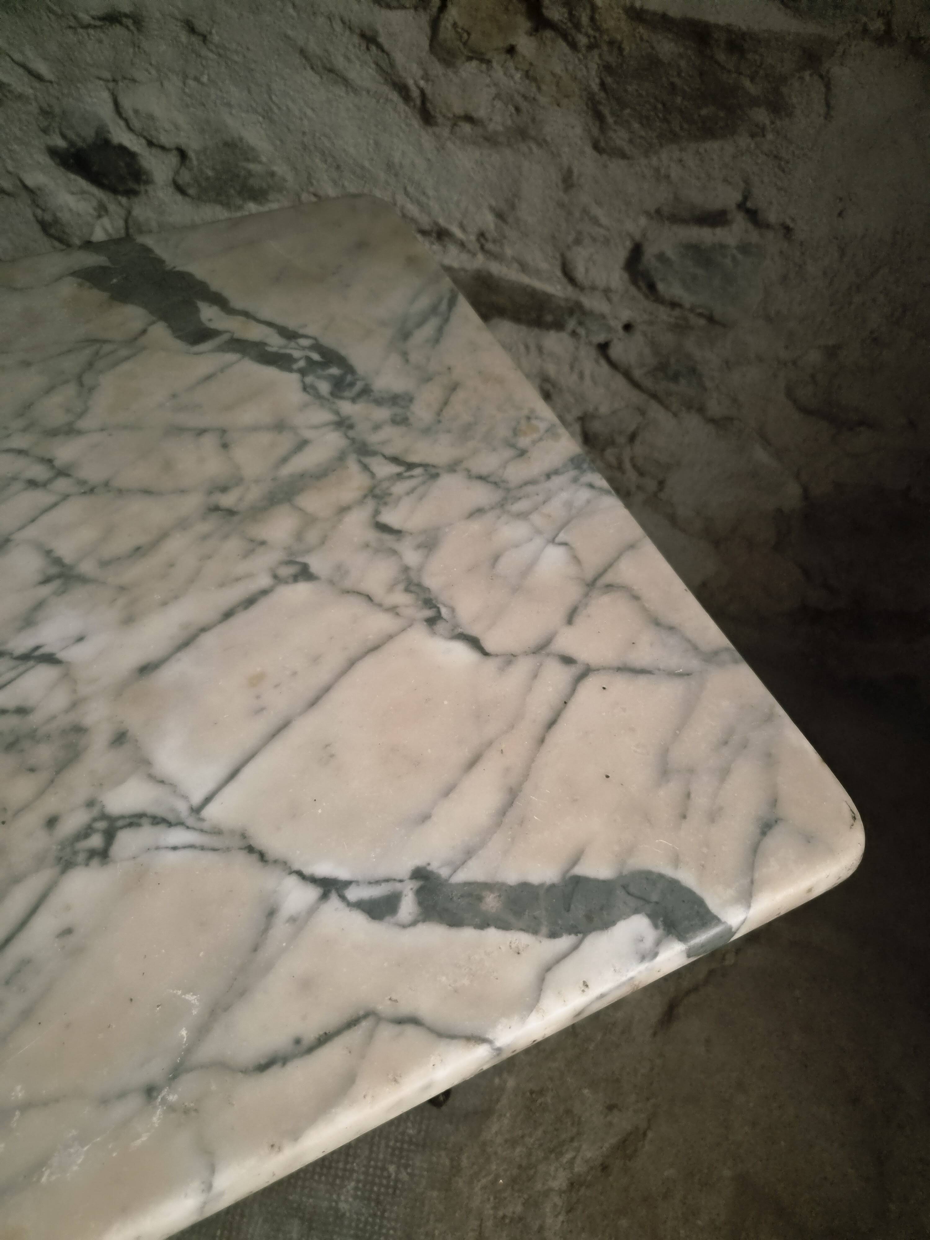 French bistro table made of marble with a cast iron base, 1920s–1930s.