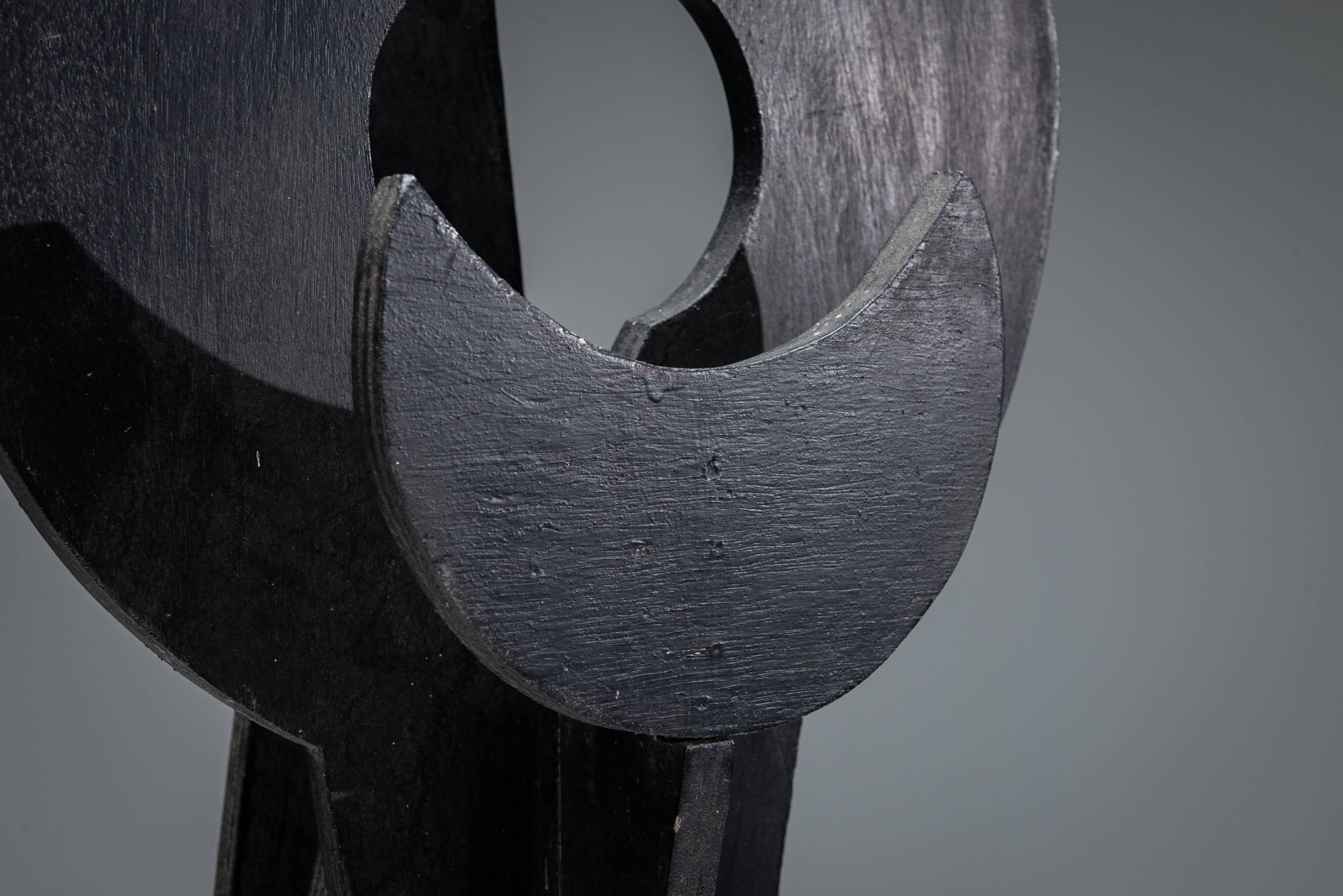 Abstract multilayered wooden sculpture with geometric shapes