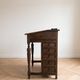 Antique wooden desk with a leather top.