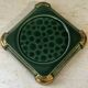 Art Deco bottle coaster in speckled green glazed ceramic and