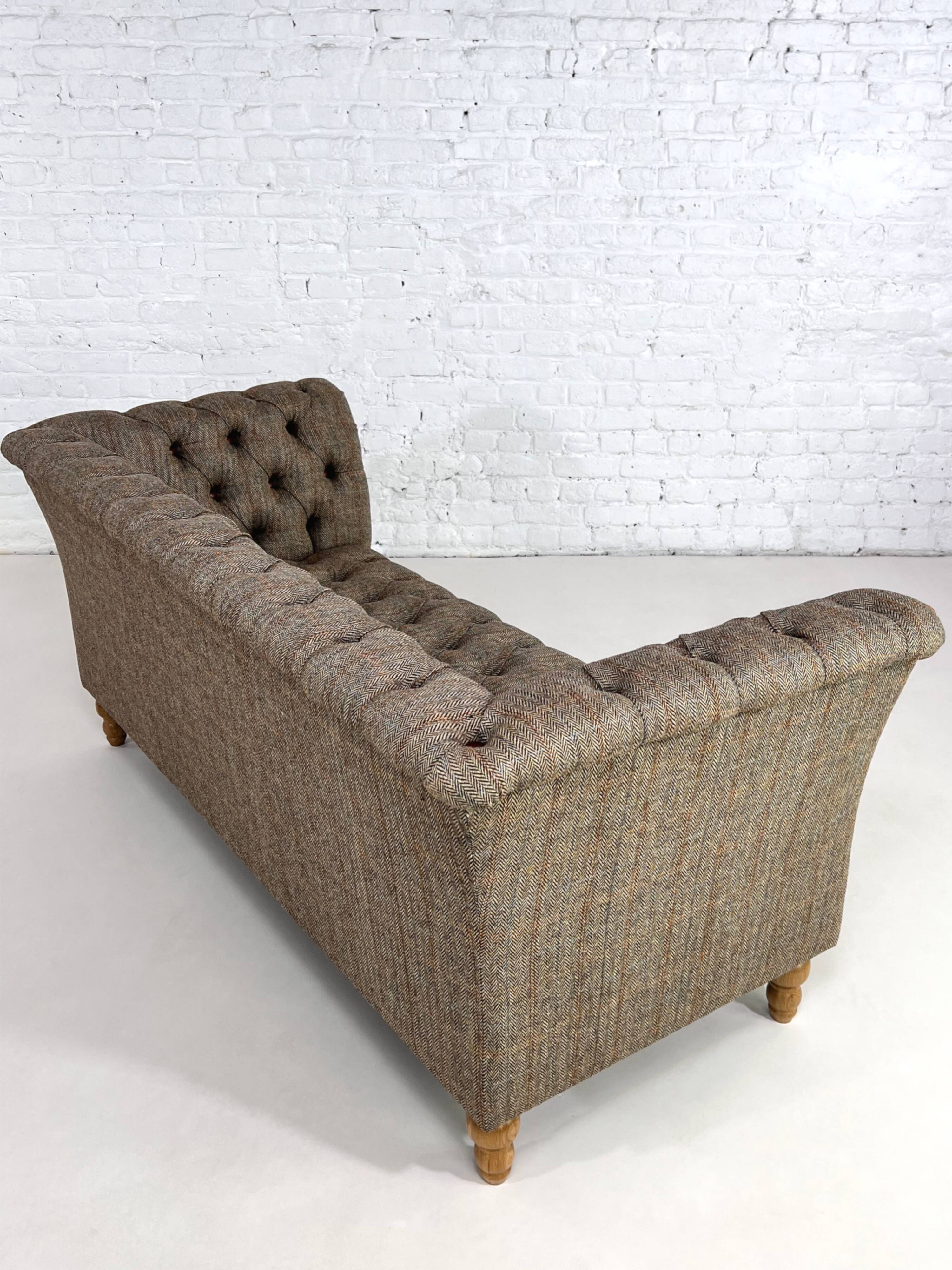 Chesterfield sofa in leather, fabric and wood