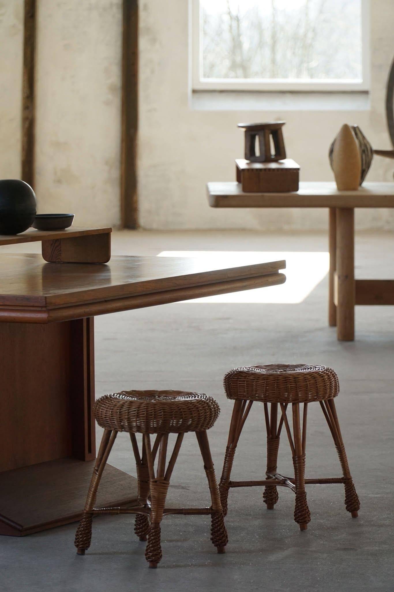 A set of 4 vintage Scandinavian rattan stools, in the style of Tony Paul, from the 1960s.