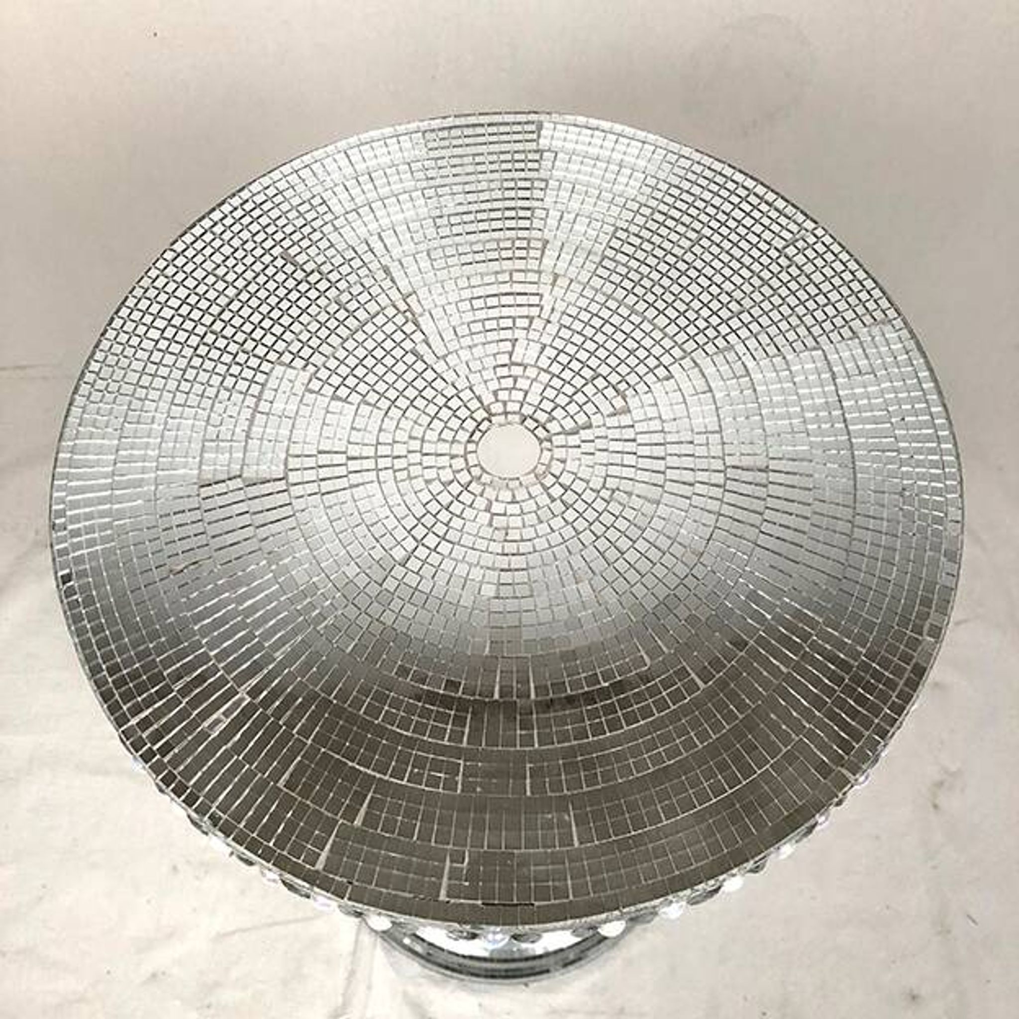Small wooden pedestal table entirely covered with mirror mosaic