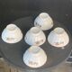 Set of 5 faceted white earthenware bowls with a naive decor, antique