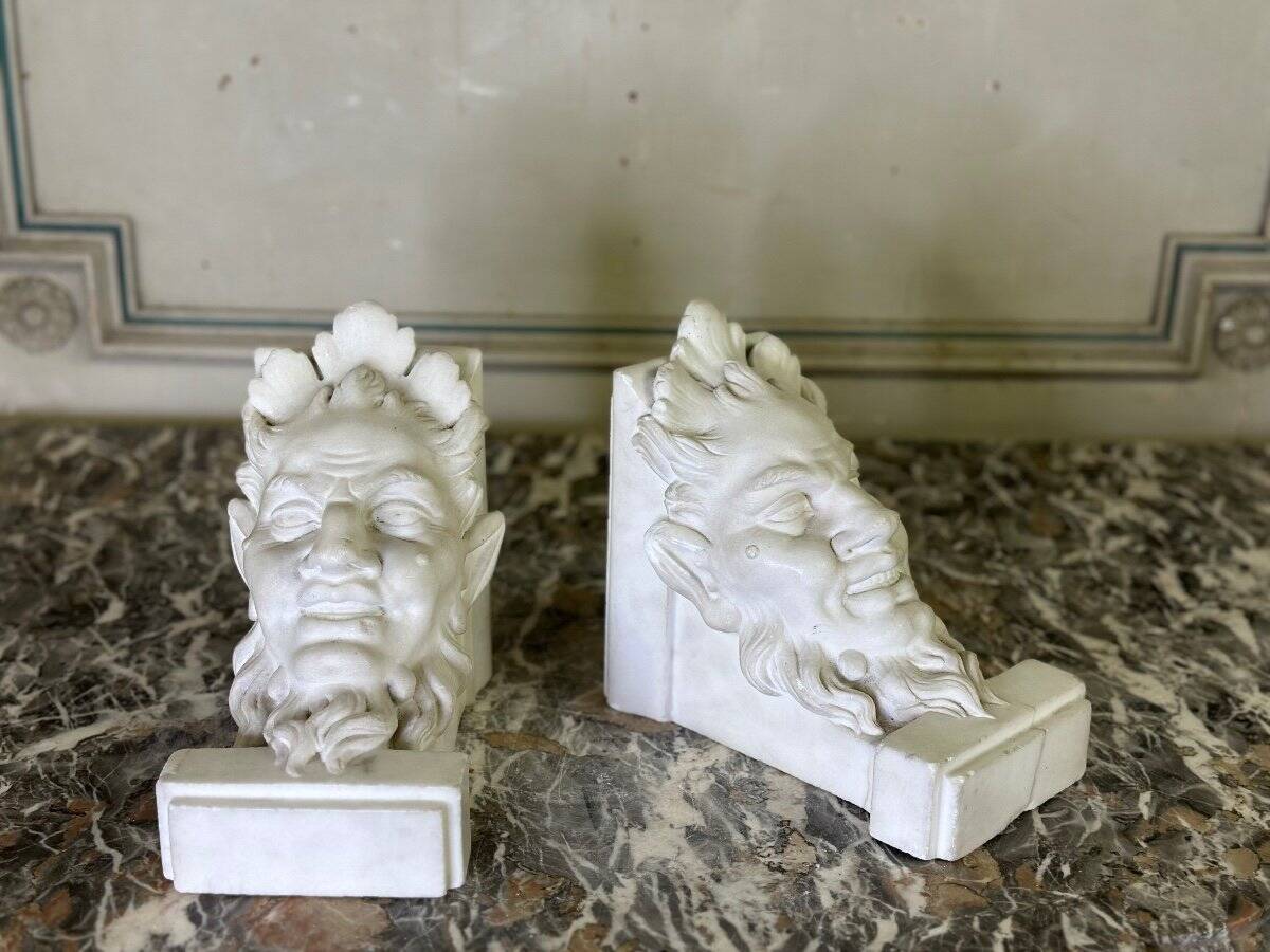 Pair of white statuary marble consoles, with faun heads