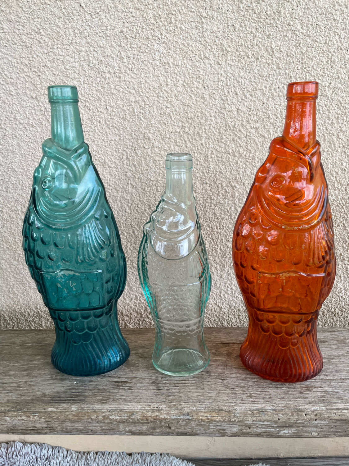 3 glass bottle fish