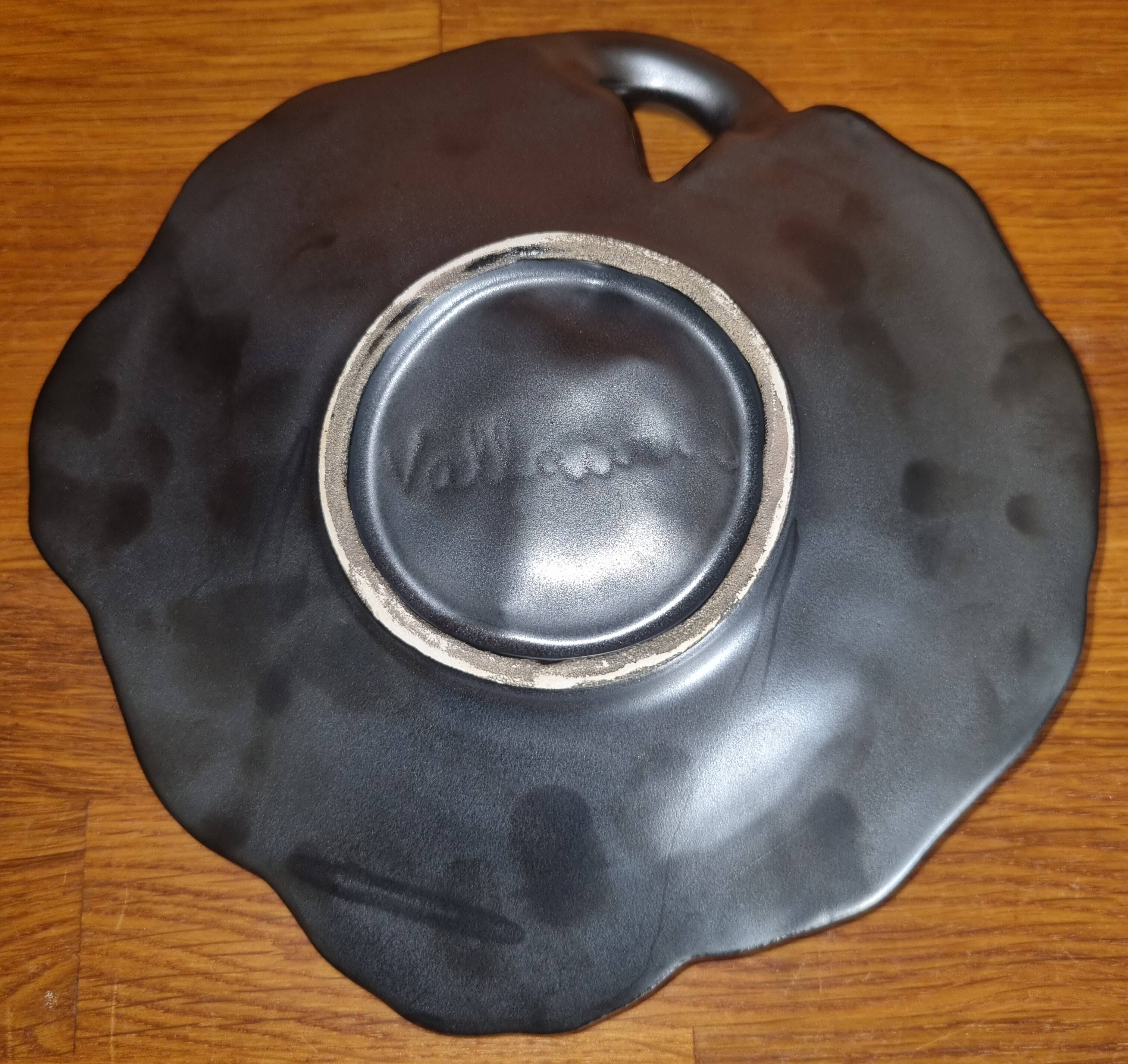 Vintage 1950s Vallauris black matte ceramic pocket bowl.