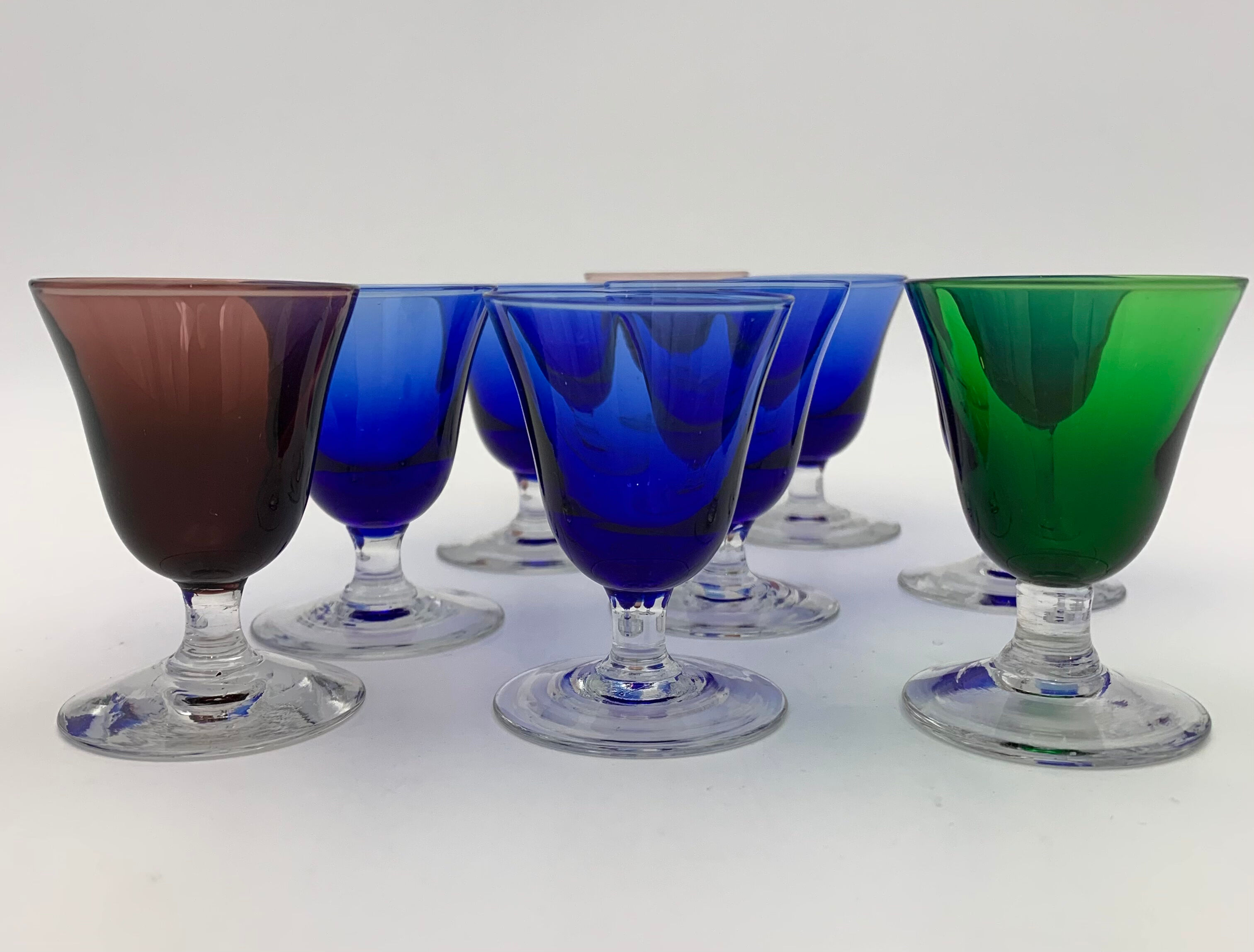 Nine vintage liquor glasses, coloured glass 20th century