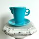 Milk jug on plate