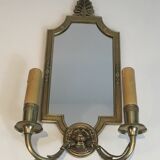Pair of mirror and bronze wall lamps with lions' heads, french work. around 1940