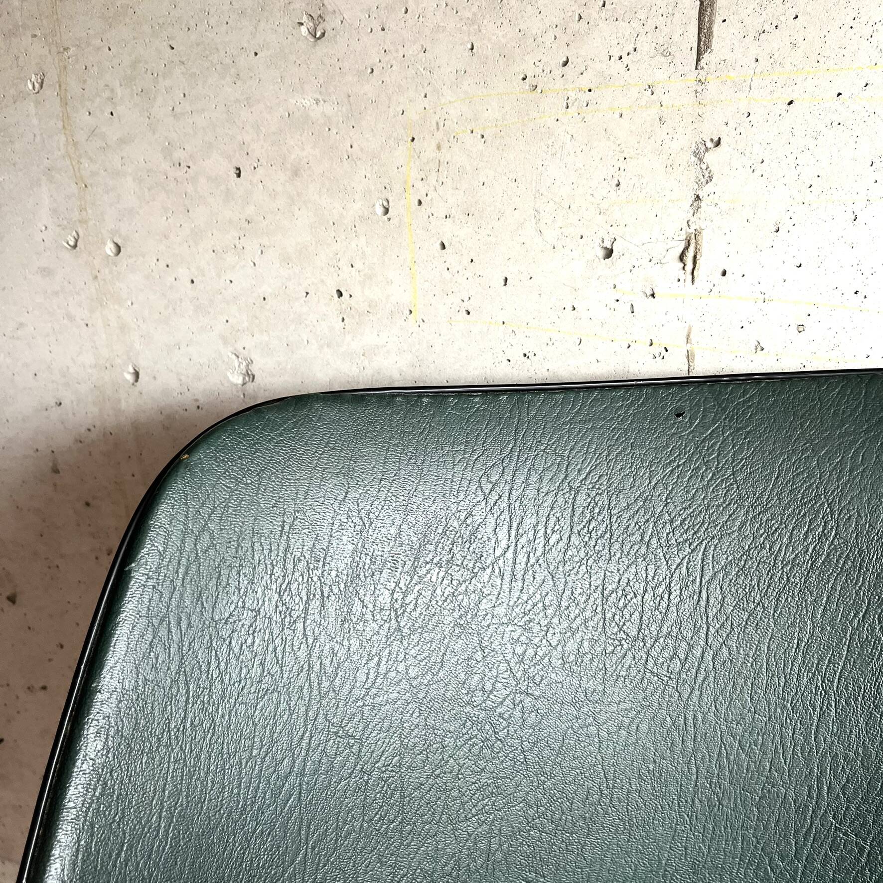 Vintage green faux leather and chrome armchair