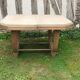 Art deco table from the 1930s in raw cherry wood
