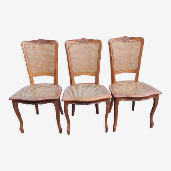 Lot de trois chaises cannées 1970