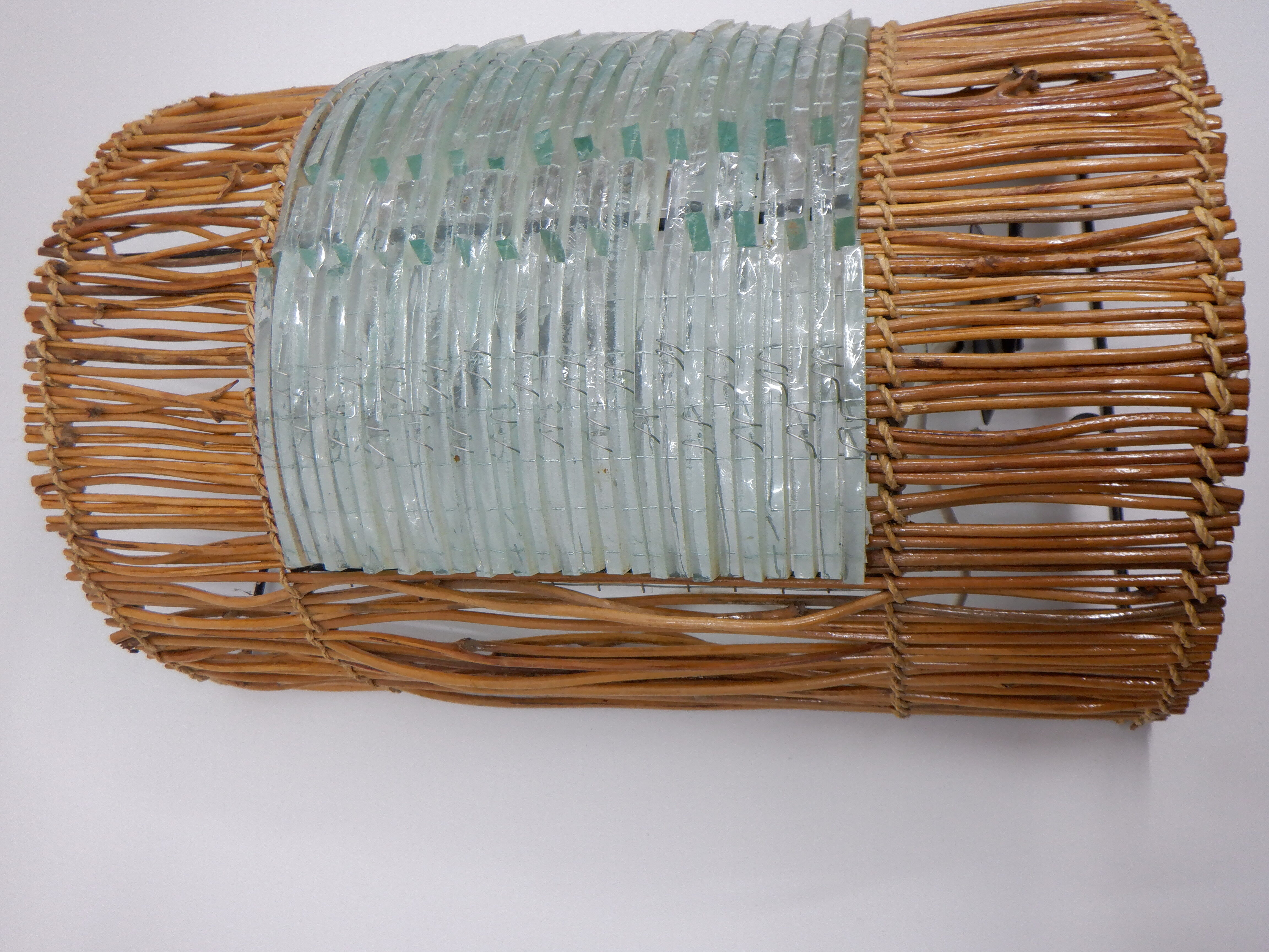 Glass and rattan sconce
