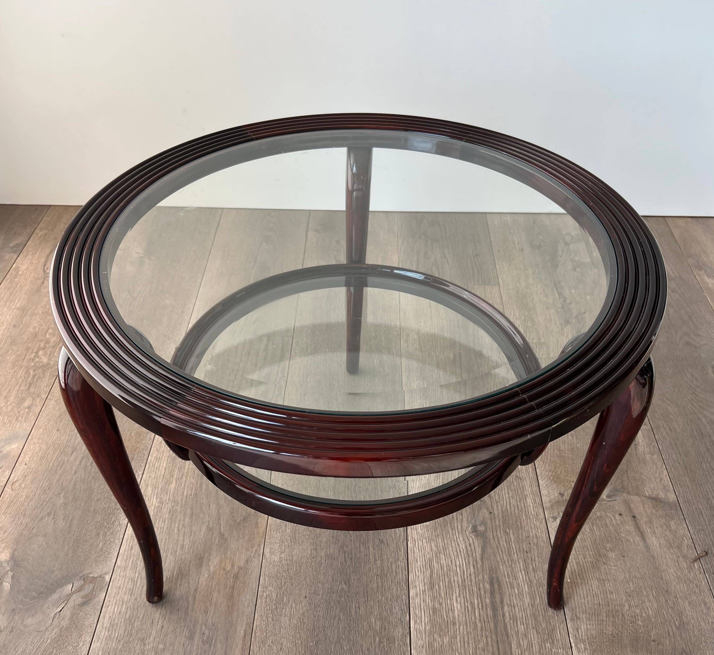Round mid-century coffee table in walnut with a double top by Paolo Buffa.