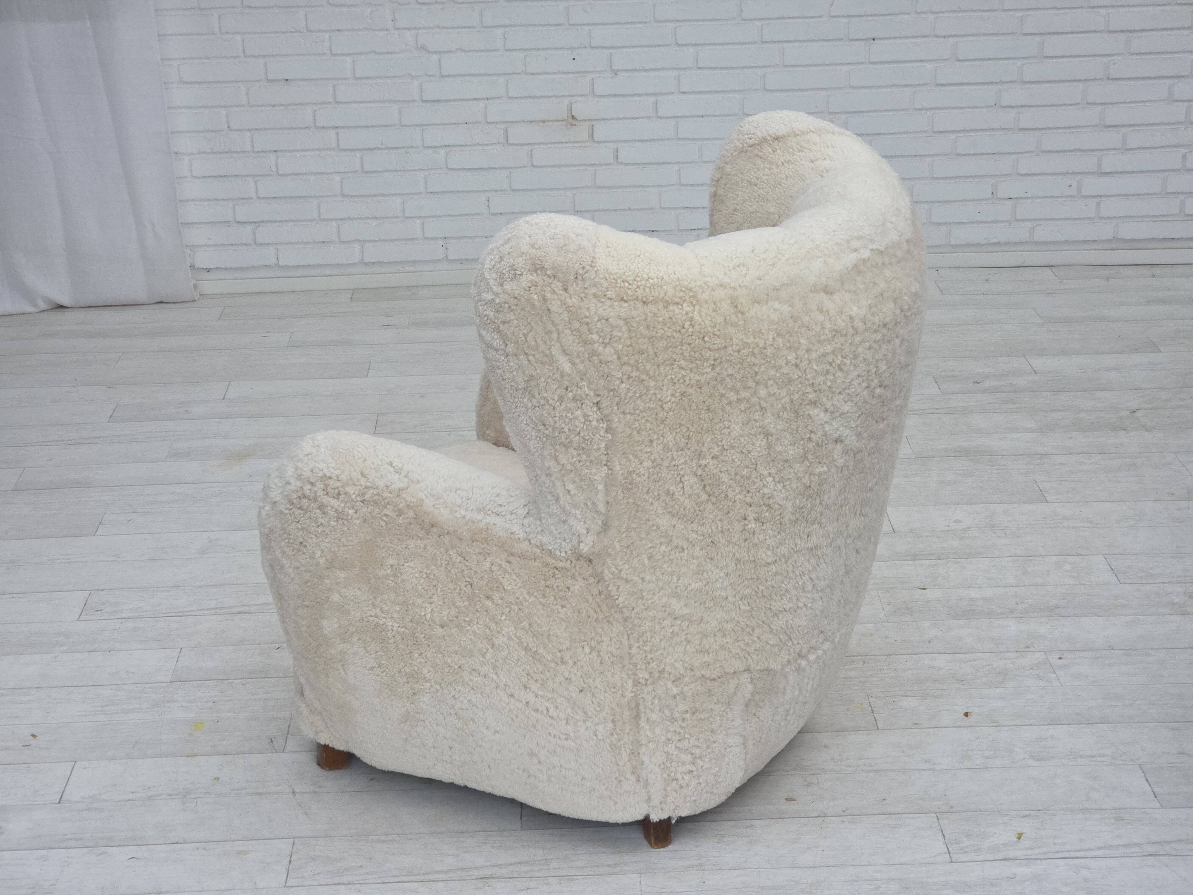 1960s, Danish design, reupholstered highback armchair, genuine sheepskin.