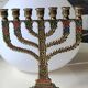 Menorah/Hebrew Candlestick with 7 branches. Astrological signs. Hanukkah. In patinated brass old gold