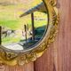 Small round antique gold mirror