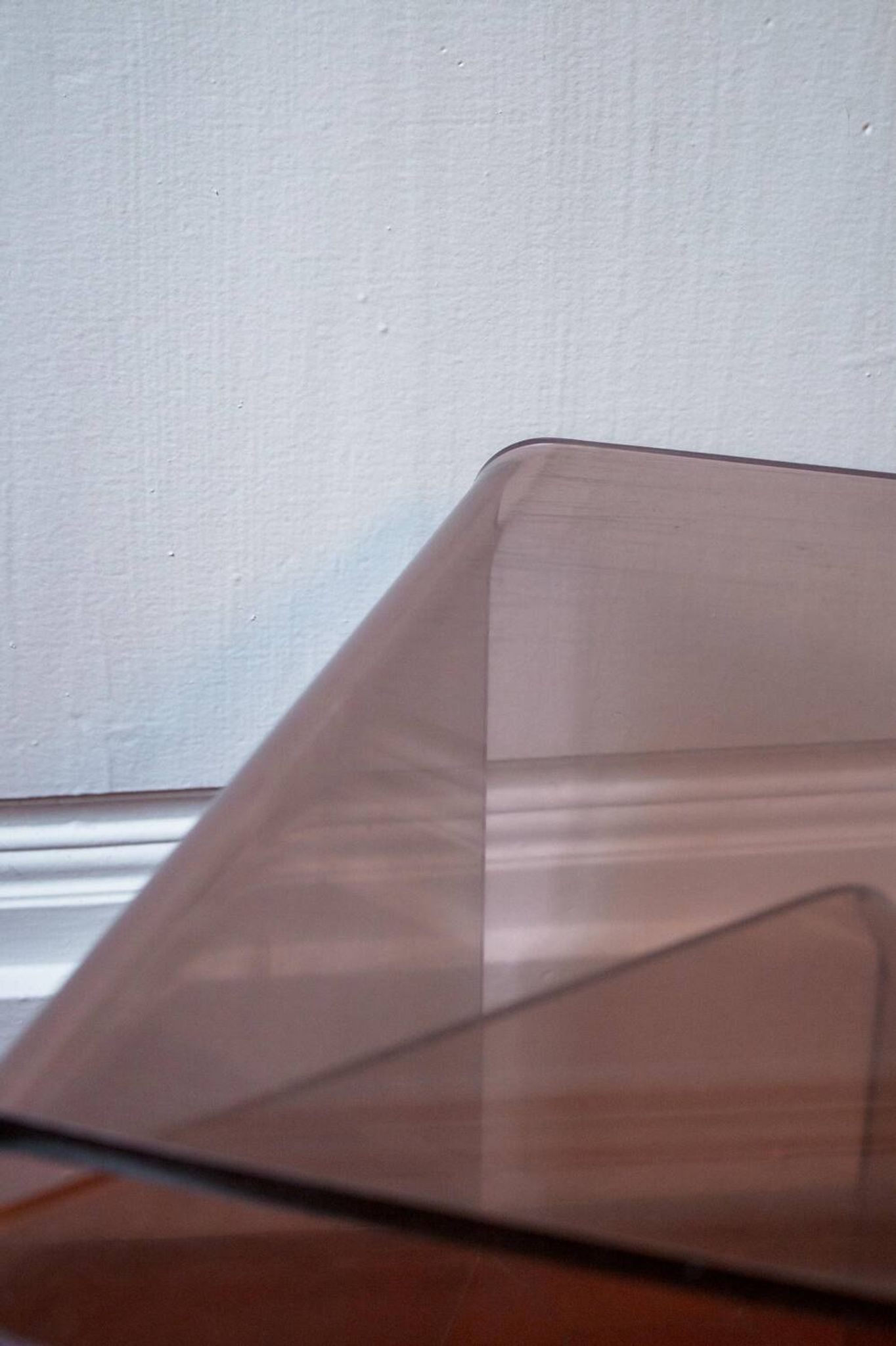 Vintage trio of nesting tables in smoked plexiglass by Michel Dumas, year.