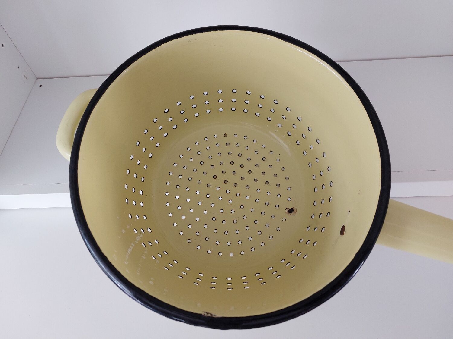 Vintage yellow enamelled strainer