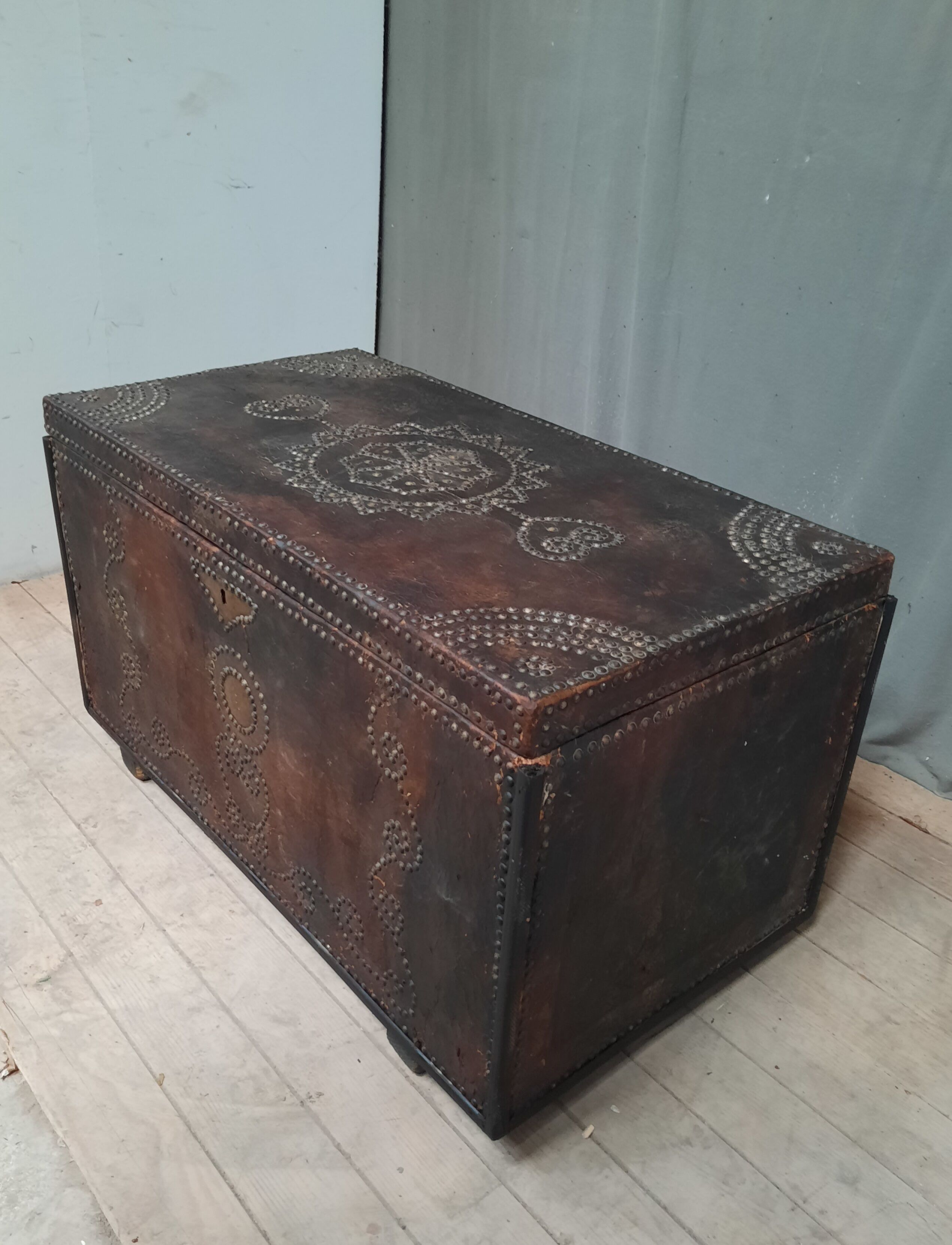 Chest covered with leather and nails