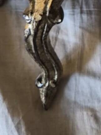 Golden wooden stool in the Louis XV style.