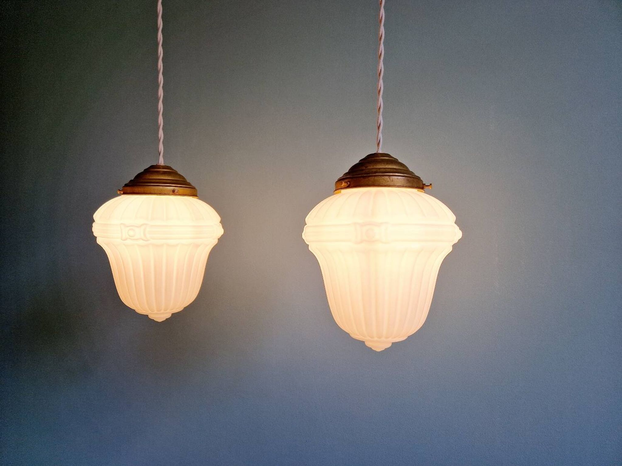 Pair of Art Deco pendant lights in pressed white opaline glass, 1920-30