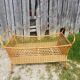 Former cradle bed baby rotin curved on vintage 60s roulettes