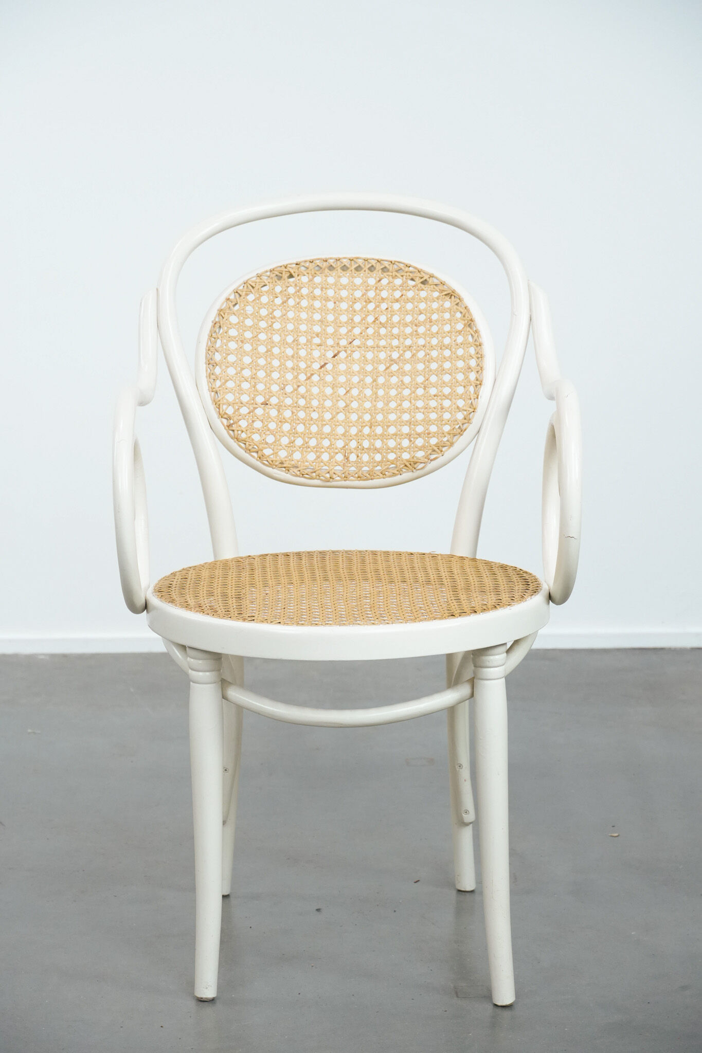 Vintage white bistro chair with armrests in Thonet style