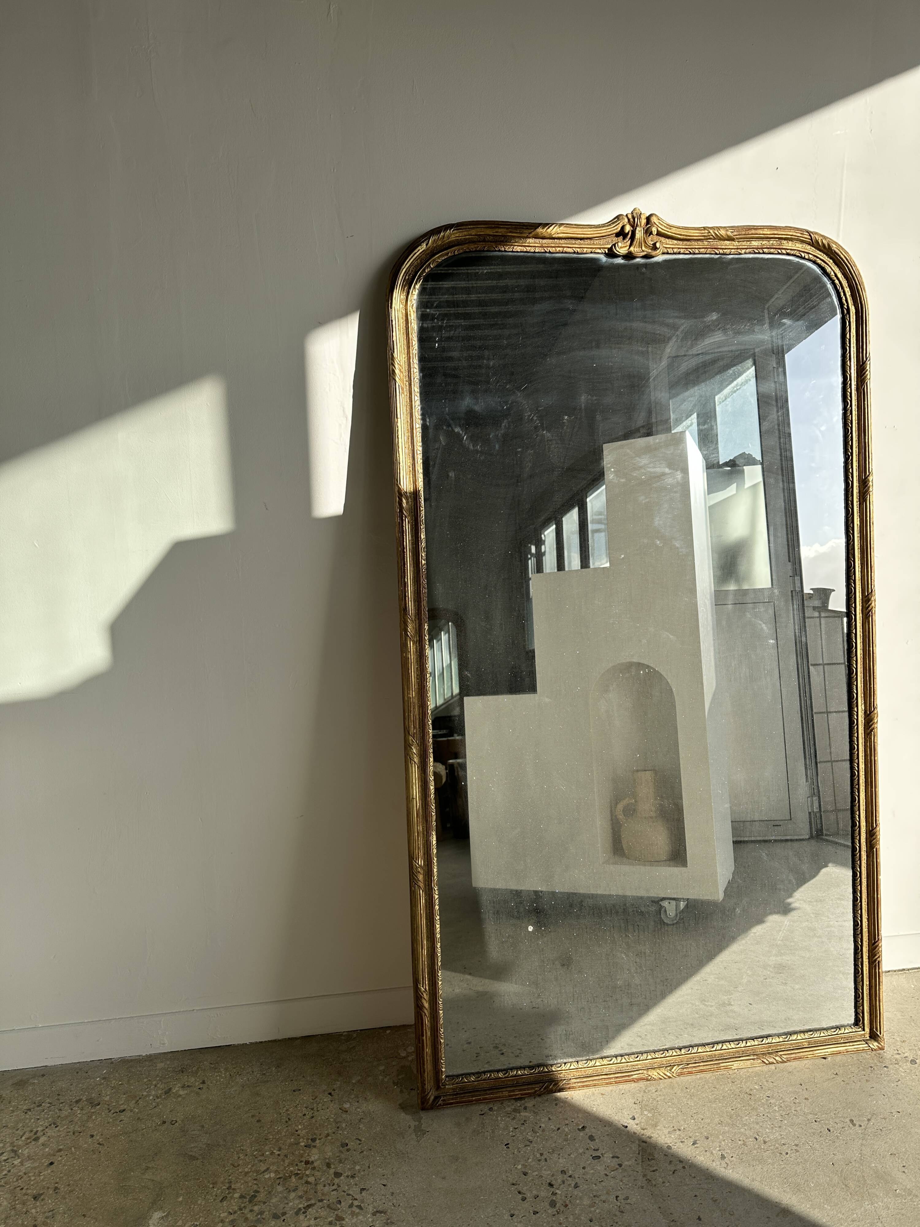 Large gilded mirror 19th century rounded corners mercury glass Louis XVI style