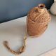 Antique amber glass bottle and hemp carrying bag