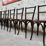 Série de 7 anciennes chaises bistrot Baumann bois courbé assise ronde