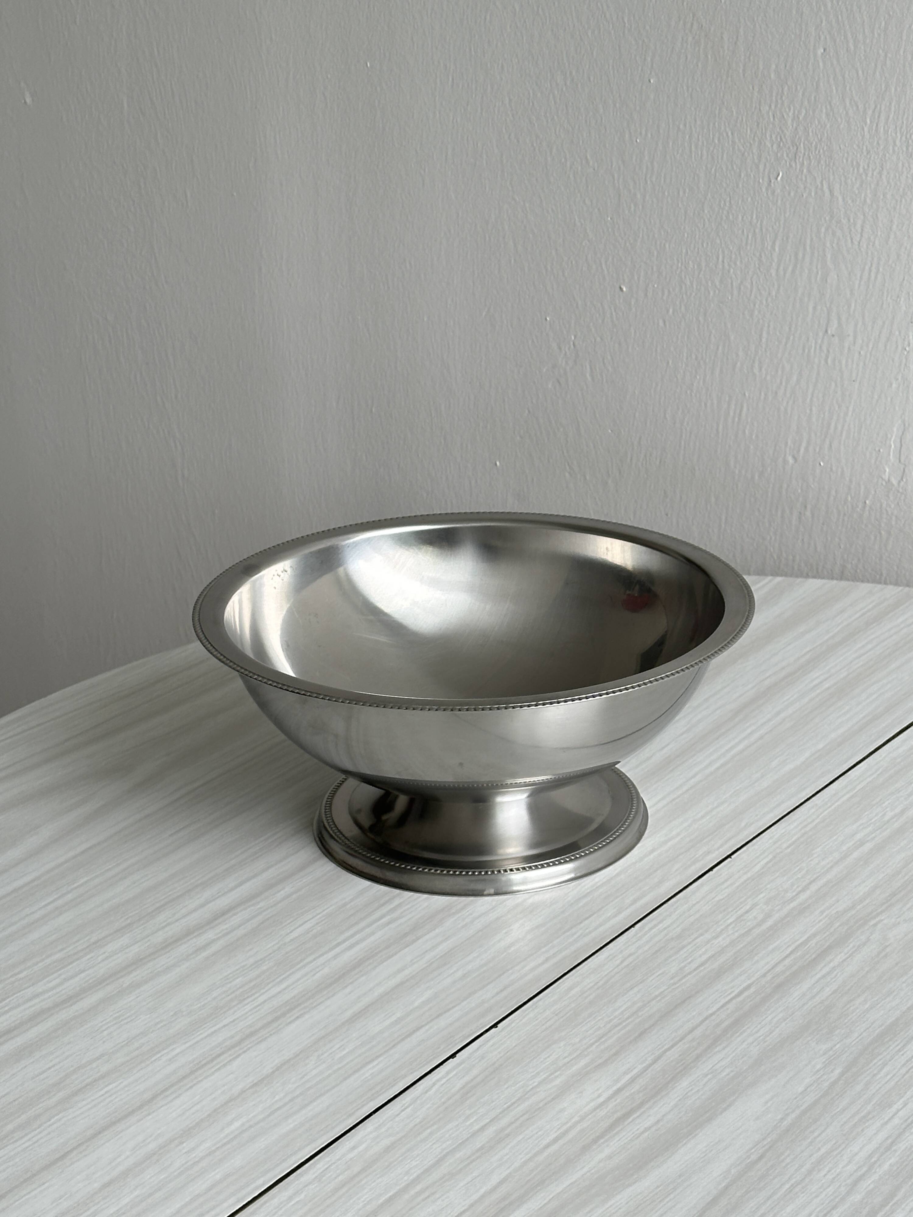 Shiny silver metal salad bowl