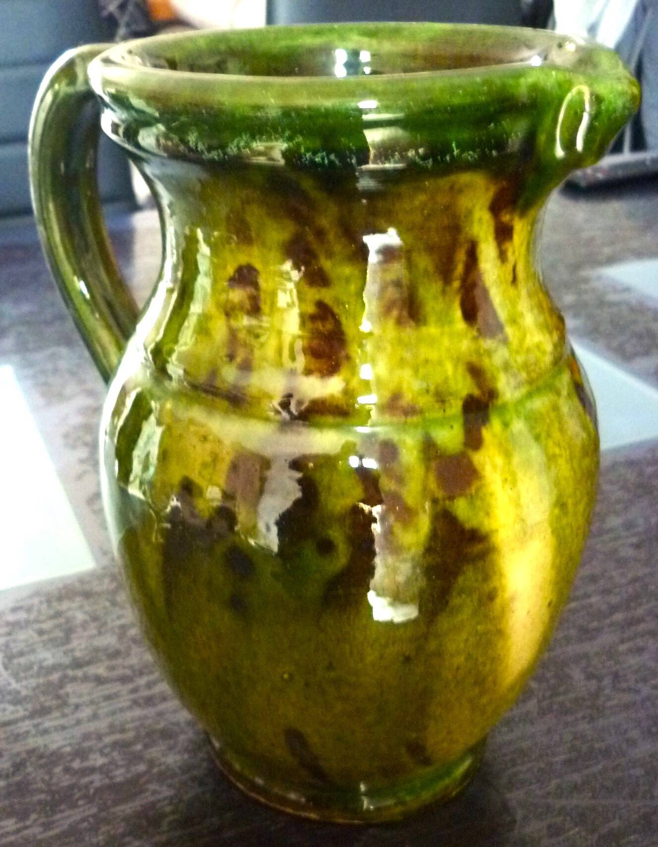 Pitcher vase, thick green glazed terracotta, signature to be identified