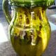Pitcher vase, thick green glazed terracotta, signature to be identified