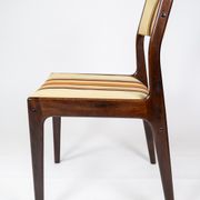 Pair of chairs in dark wood upholstered with light striped fabric of danish design