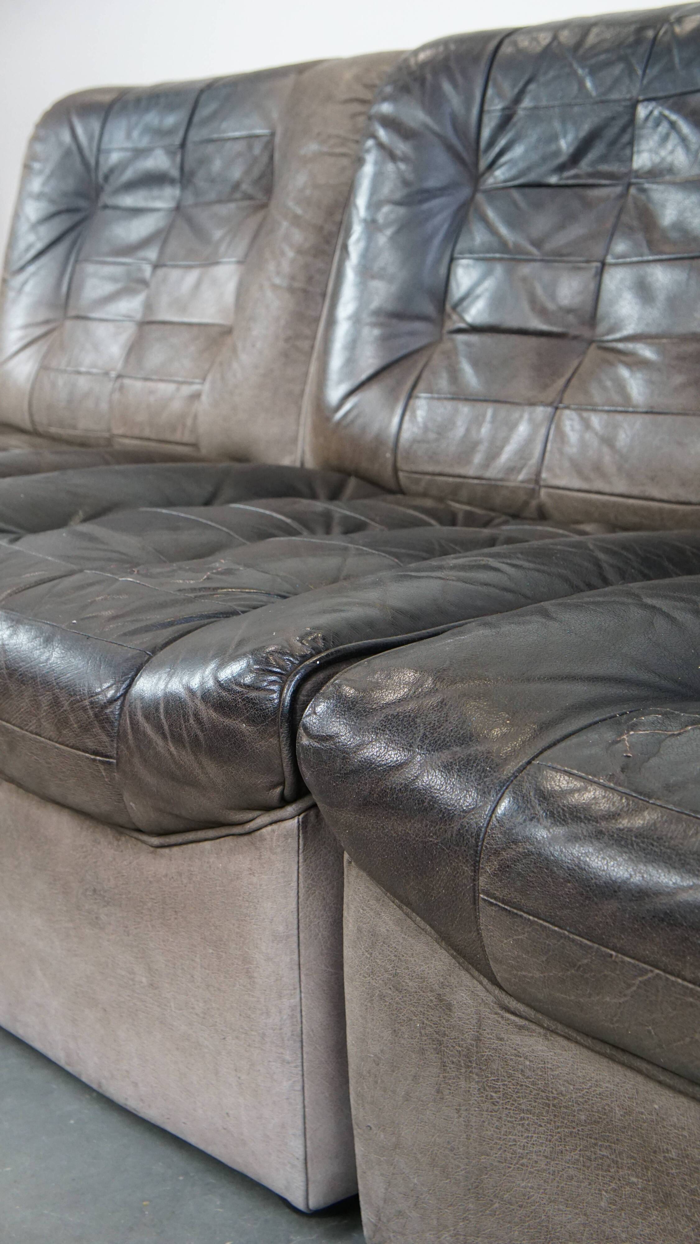 Canapé design modulable en cuir gris, 3 modules et 1 repose-pieds