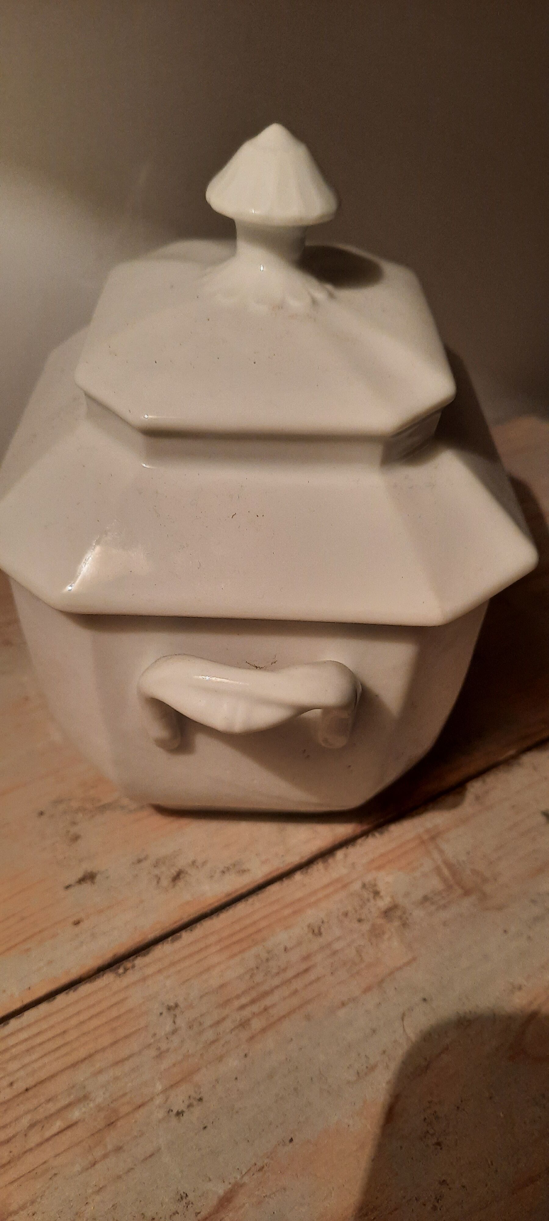 Old sugar bowl in white porcelain
