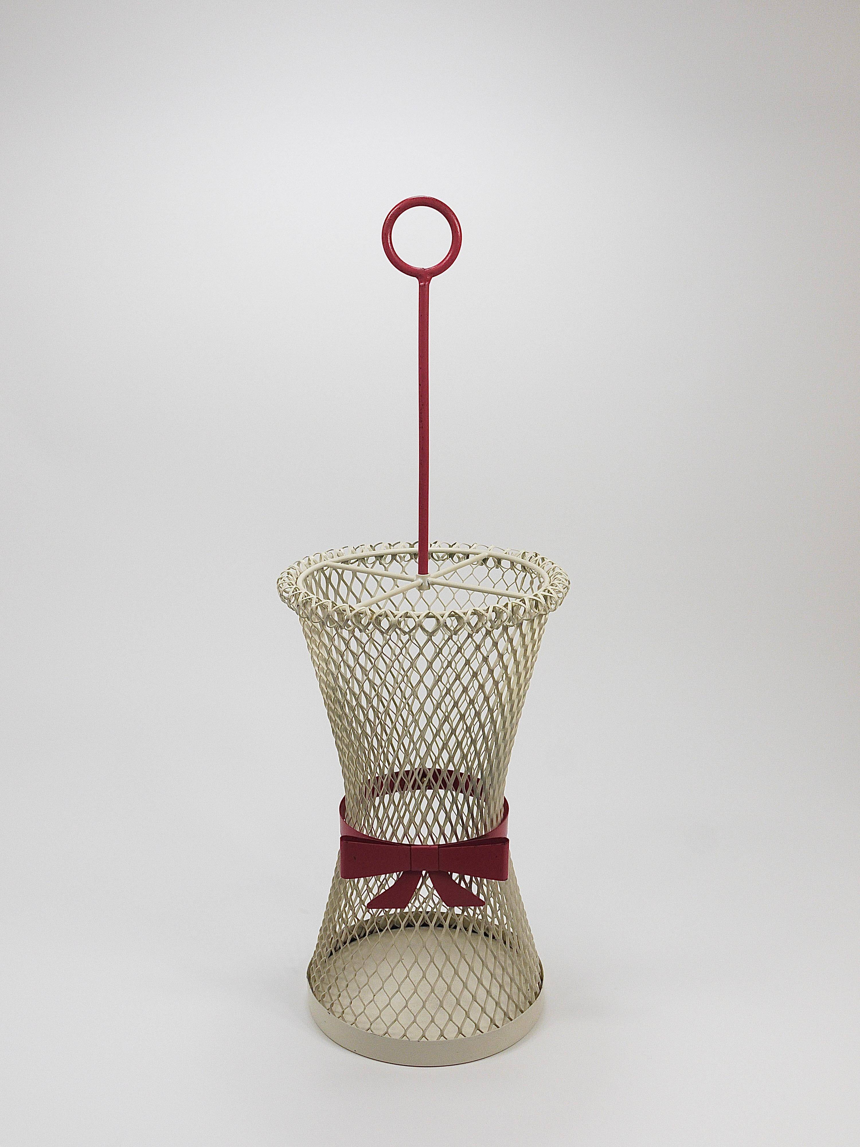 Bow tie umbrella stand in the style of Mathieu Matégot, mid-century, metal, France, 1950s.
