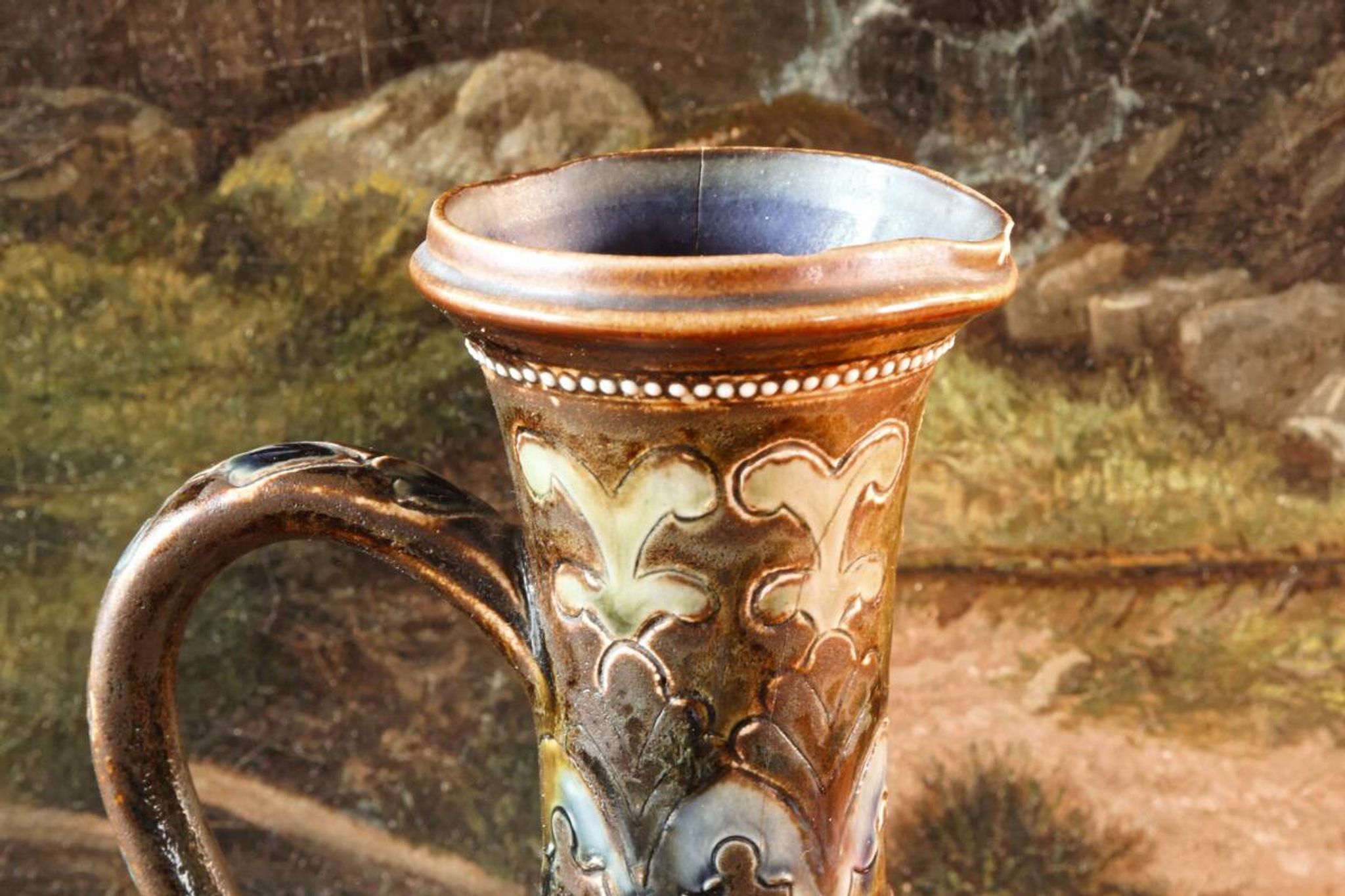 Doulton Lambeth stoneware jug (1879), floral decoration by Henry Winstanley.