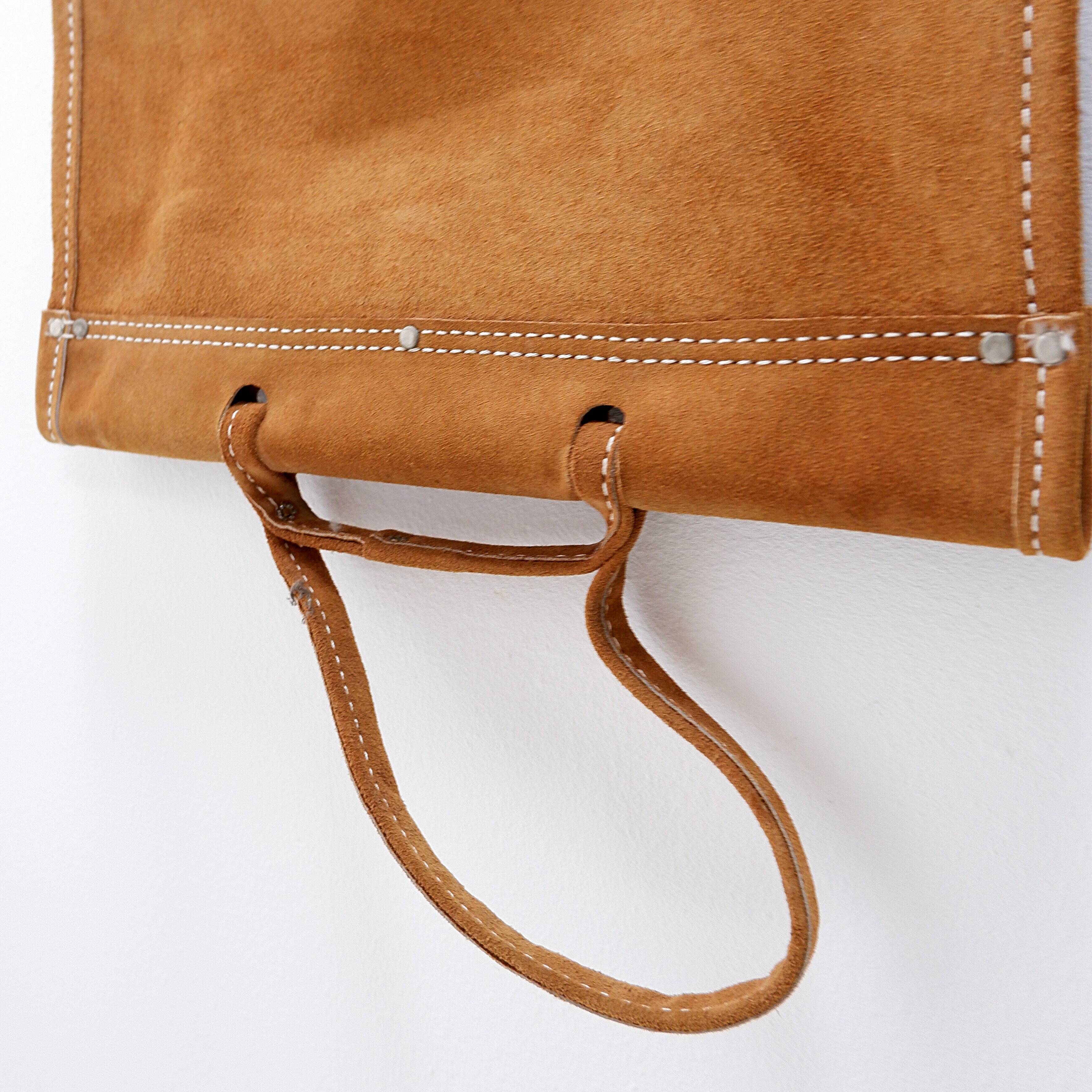 Wrought iron log holder with suede log holder