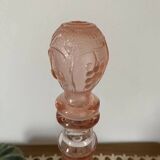 Pink glass carafe with frosted and embossed fruit patterns.