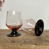 4 pink glasses with black stem
