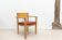 Scandinavian style oak and burgundy chair with armrests
