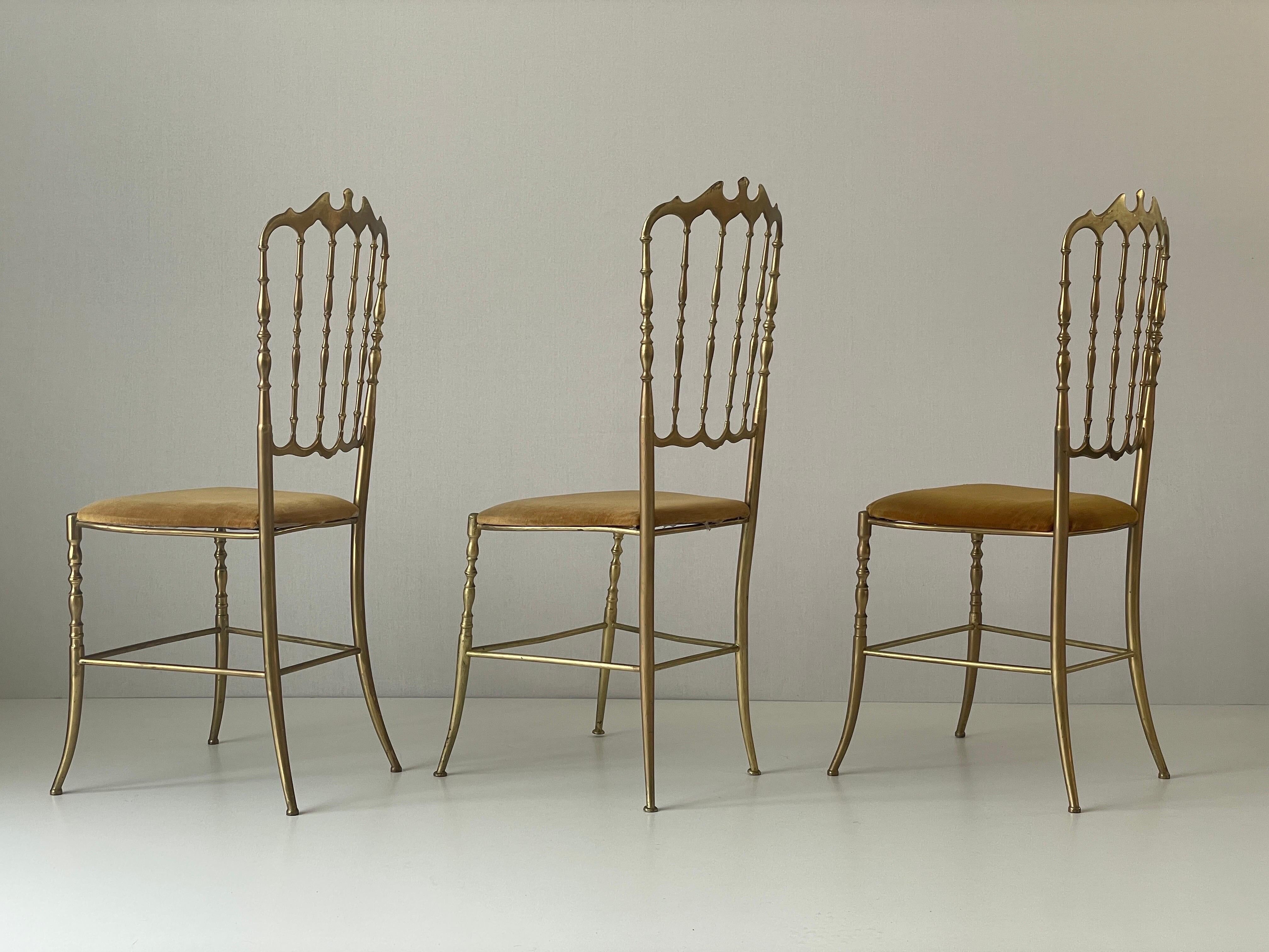 Set of 3 Chiavari chairs in brass with velvet seat and high back, 1950s, Italy.